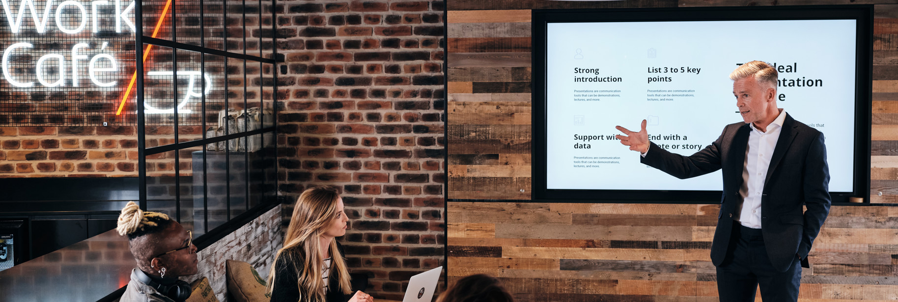 Man giving presentation in event space in Jersey Work Cafe